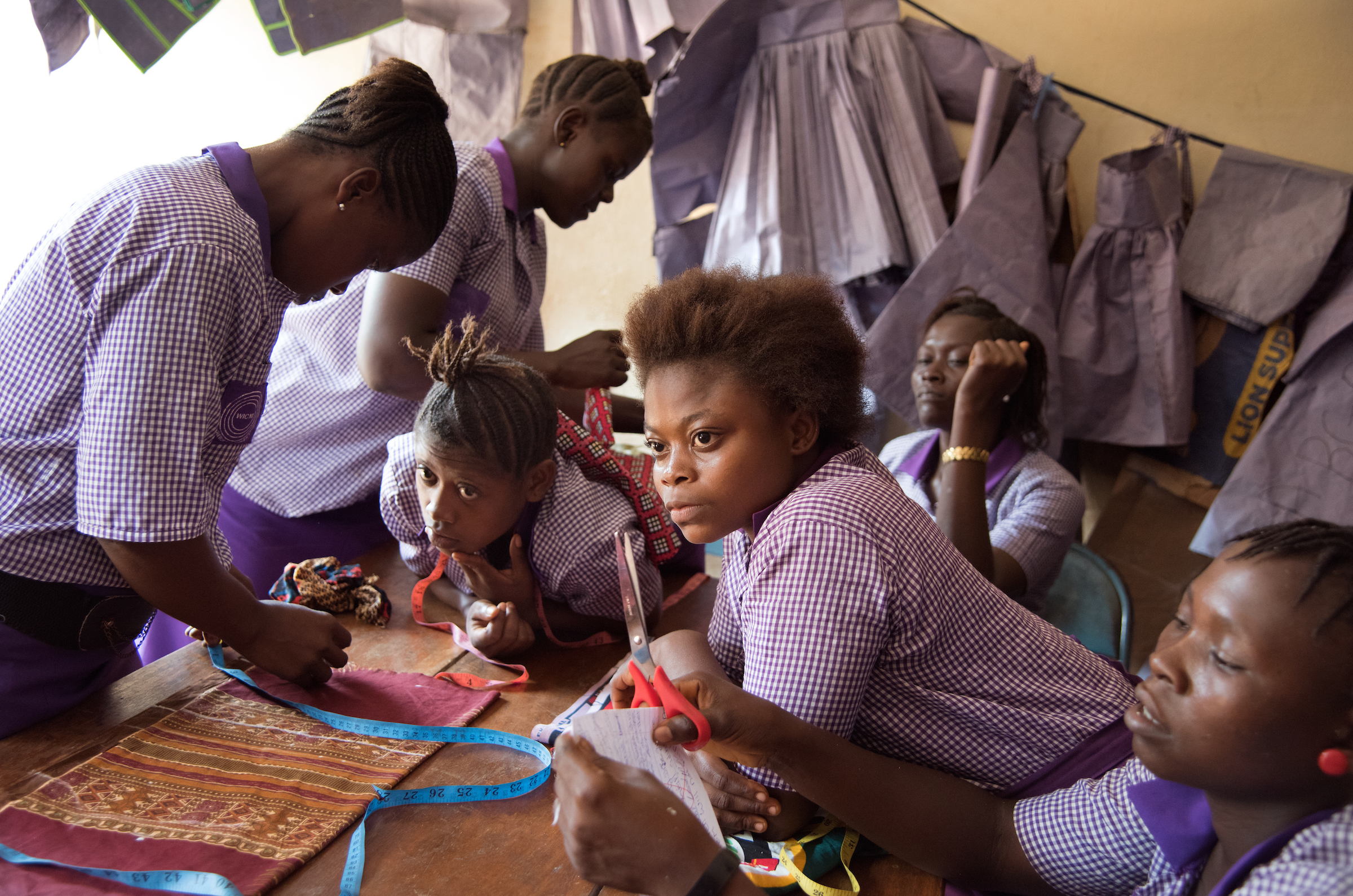 Adolescent girls take part in sewing classes offered by Women in Crisis in Freetown, Sierra Leone.
